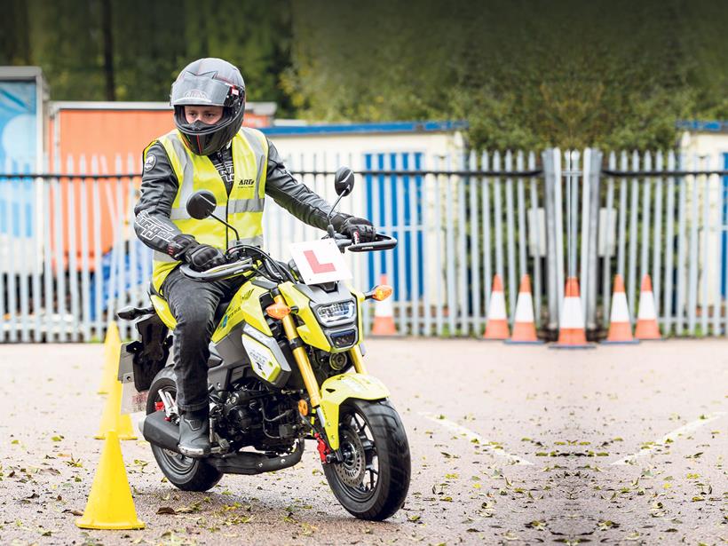 Learner rider navigating cones