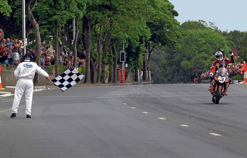 John McGuinness does the first 130mph TT lap