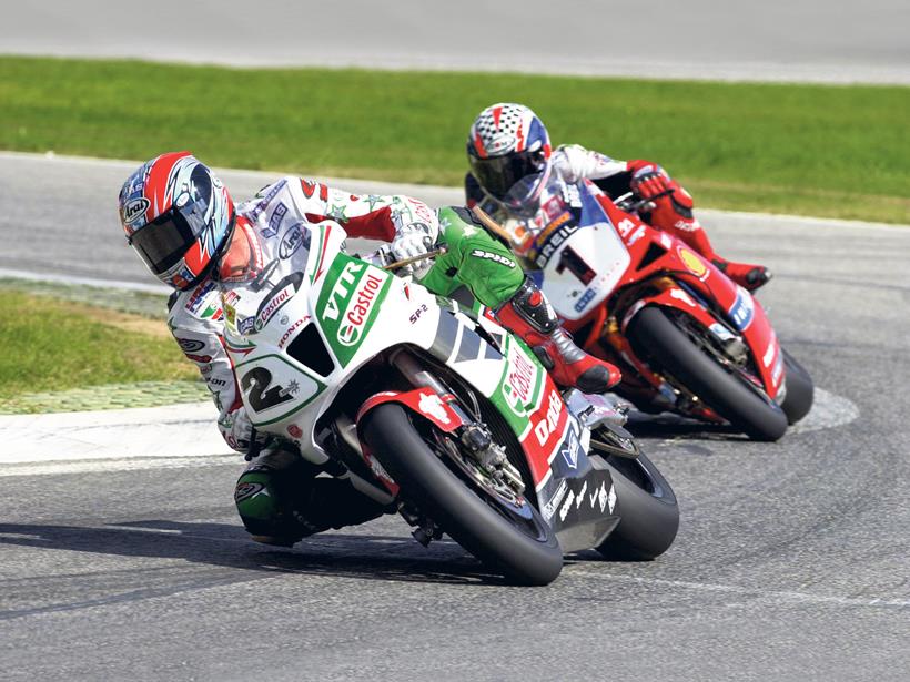 Colin Edwards riding a Honda SP2 leads Foggy on a Ducati 996 