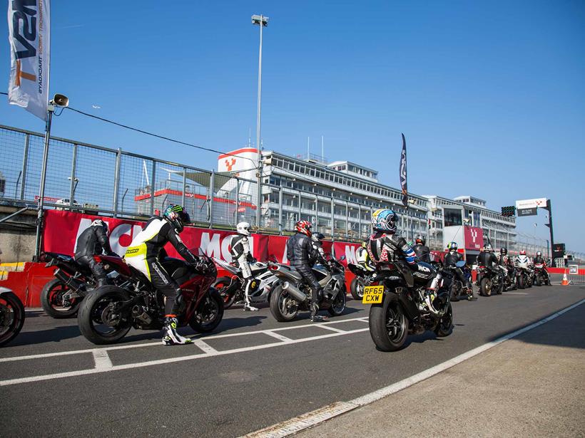 Riders wait in the pit lane at Brands Hatch