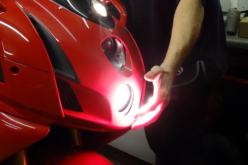 Checking a motorcycle headlight