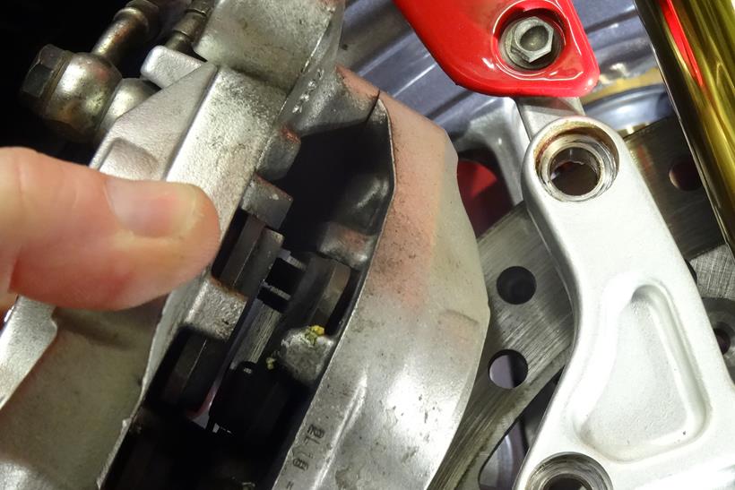 Checking motorbike brake pads