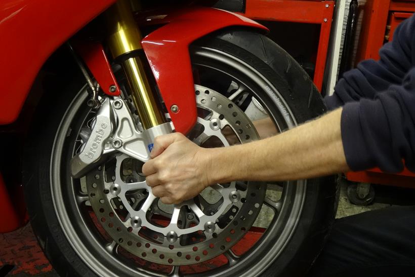 Checking a motorcycle's head race bearings