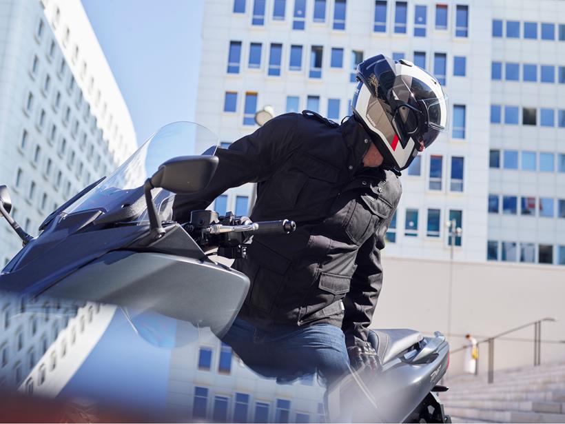 A rider with a modular SHARK helmet