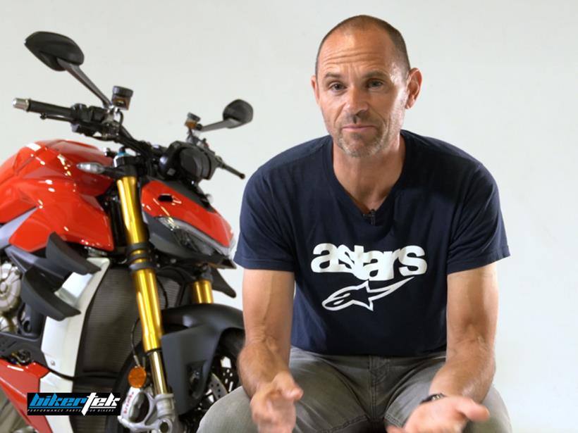 Michael Neeves cleaning a motorbike