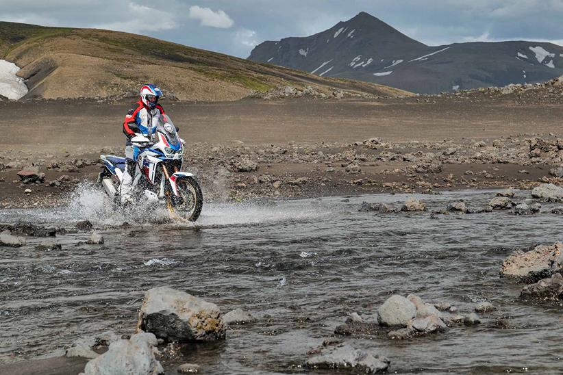 Crossing a river on a Honda Africa Twin