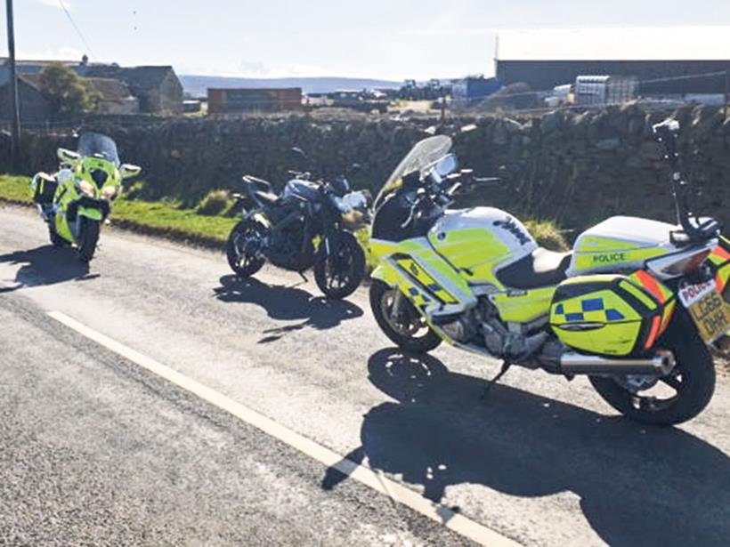 Police stop a biker