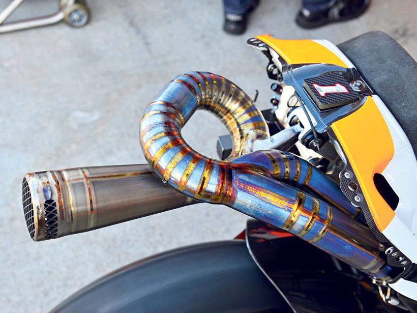 The titanium exhaust system on a Honda MotoGP bike