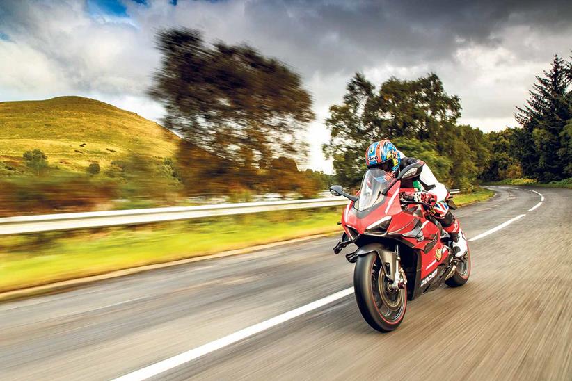 Tucked in on the road aboard the Ducati Superleggera V4