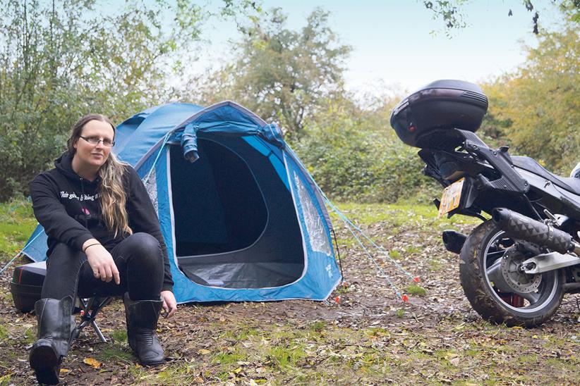 Sera Jay with her tent and Honda Blackbird