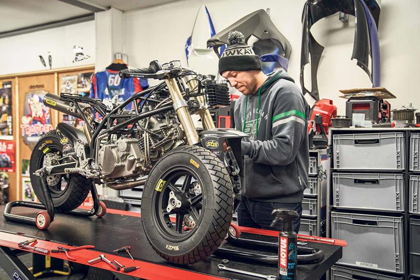 Peter Hickman busy preparing an Ohvale for a customer