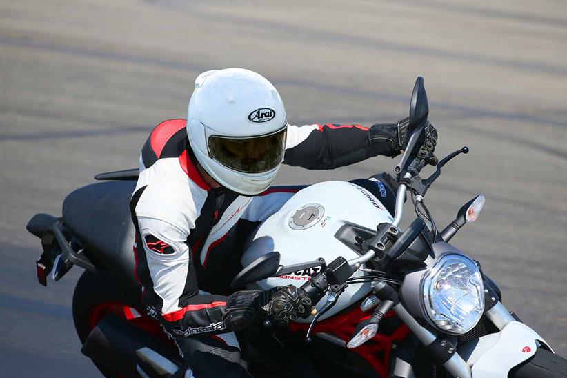 A motorcyclist wearing an Arai Quantic