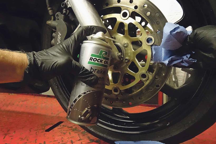 Cleaning motorcycle brake disc