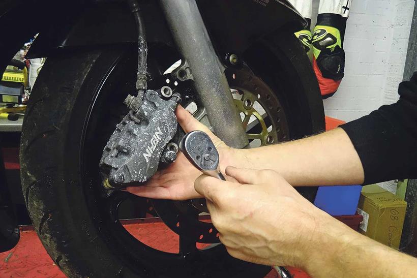 Removing motorcycle brake caliper