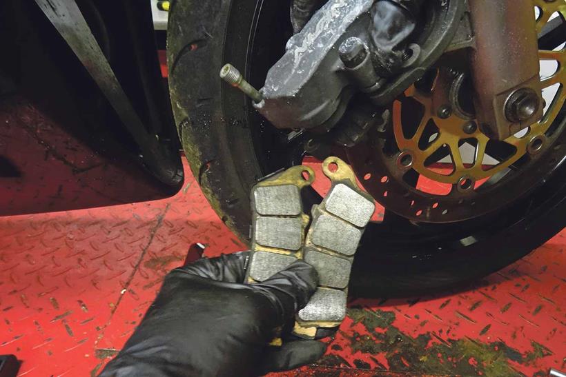 Removing motorcycle brake pads