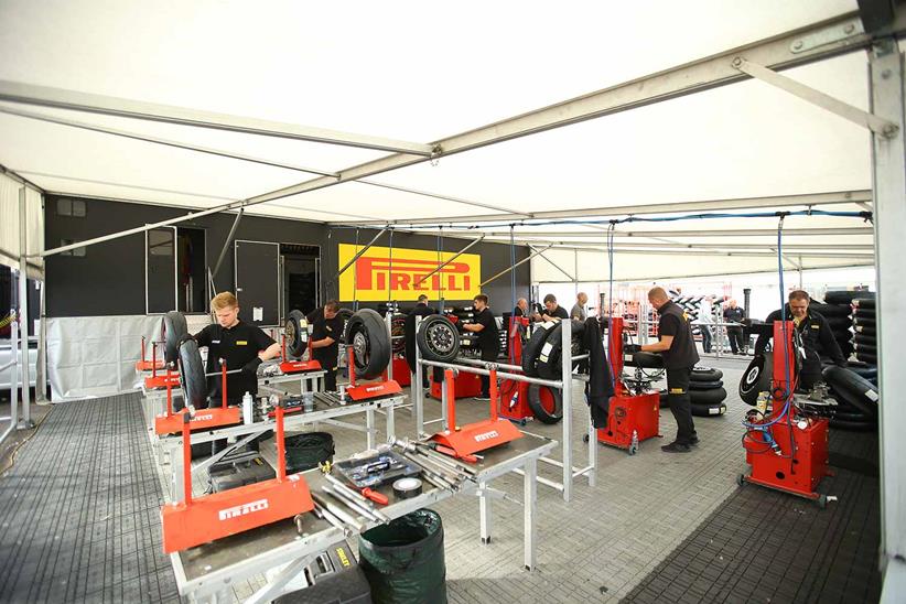 Pirelli's tyre fitting area is always busy