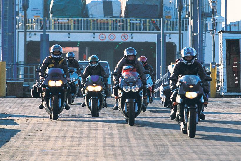 Motorbikes disembark from a ferry