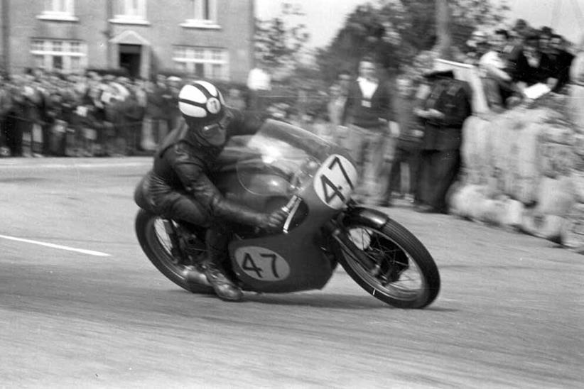 Chris Conn, pictured on his was to his 500cc victory in 1963, has died