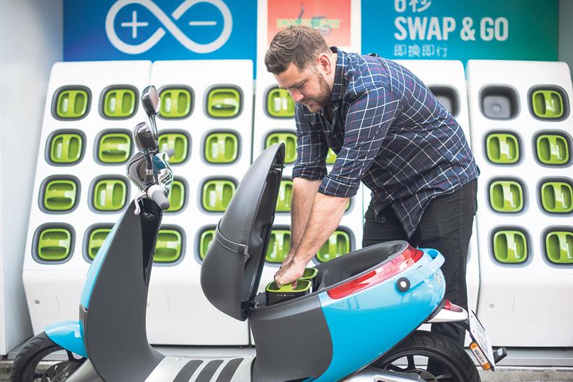 Swapping scooter batteries at a charging station