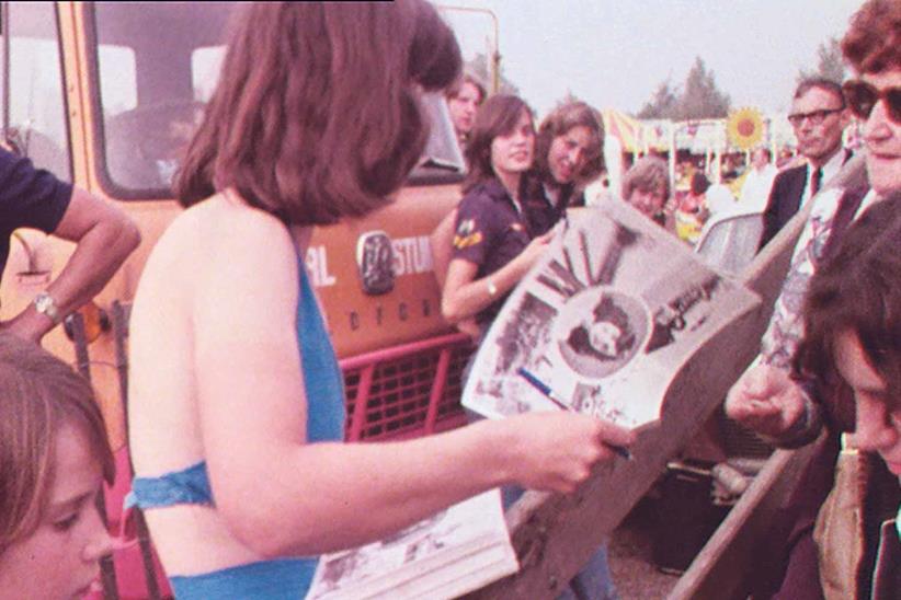 Signing autographs at a show