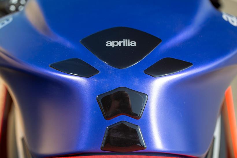 The Aprilia tank pad leaves lots of exposed plastic