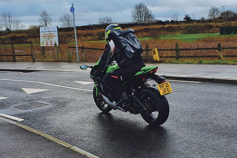 Kawasaki ZX-10R in winter gear and rucksack can feel precarious