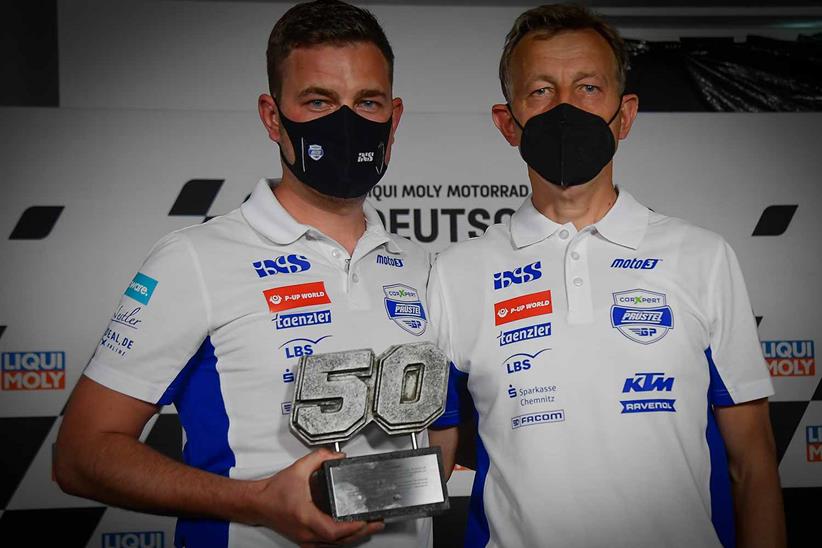 Team Manager Florian Prüstel (left) and Team Owner Ingo Prüstel with the trophy marking the retirement