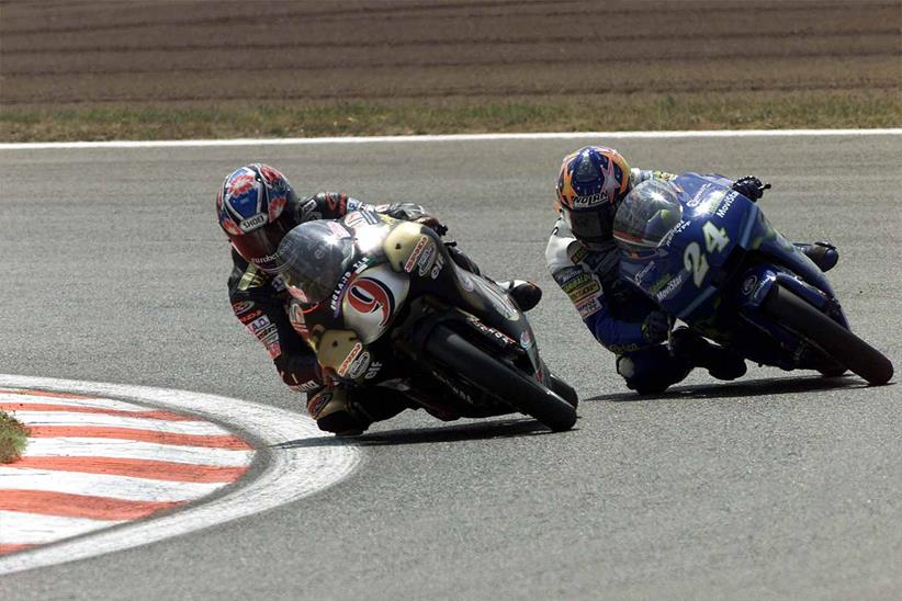 Cecchinello battles Toni Elias on the way to victory on his Aprilia