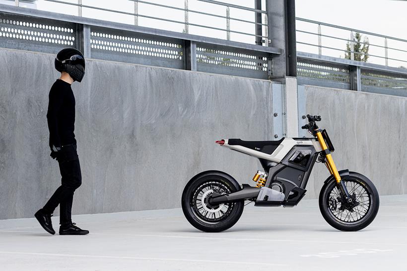 A rider walks to the DAB Motors Concept-E