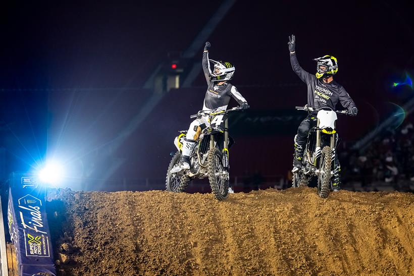 A pair of Triumph motocross bikes being ridden