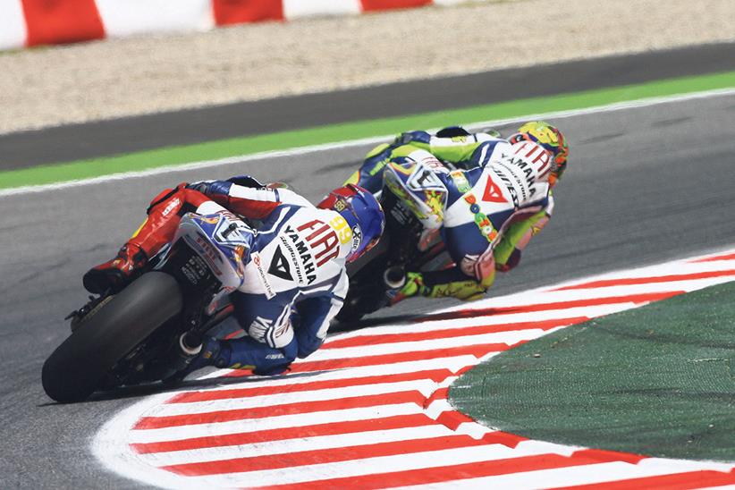 Rossi battles with teammate Jorge Lorenzo