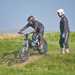 Tackling a drop on an electric trials bike