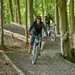 Riding an electric trials bike through woodland