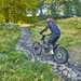 Riding over cobbled paths on an electric trials bike