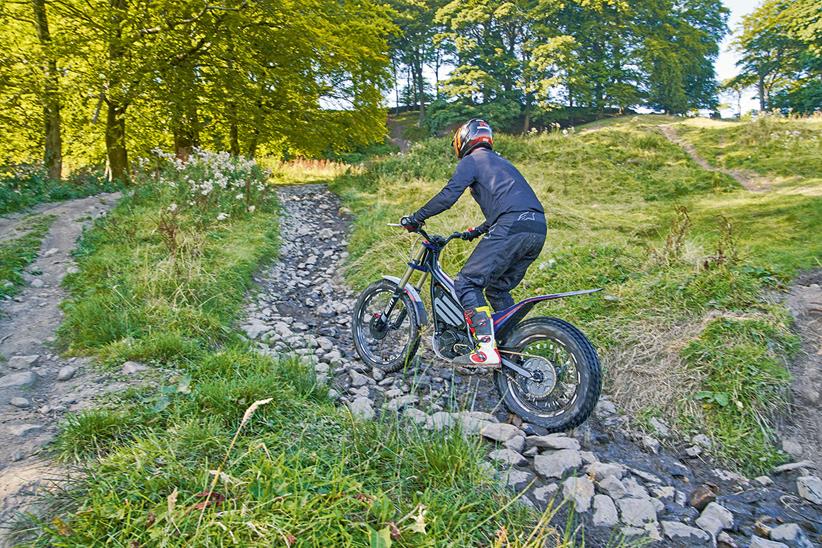 Riding over cobbled paths on an electric trials bike