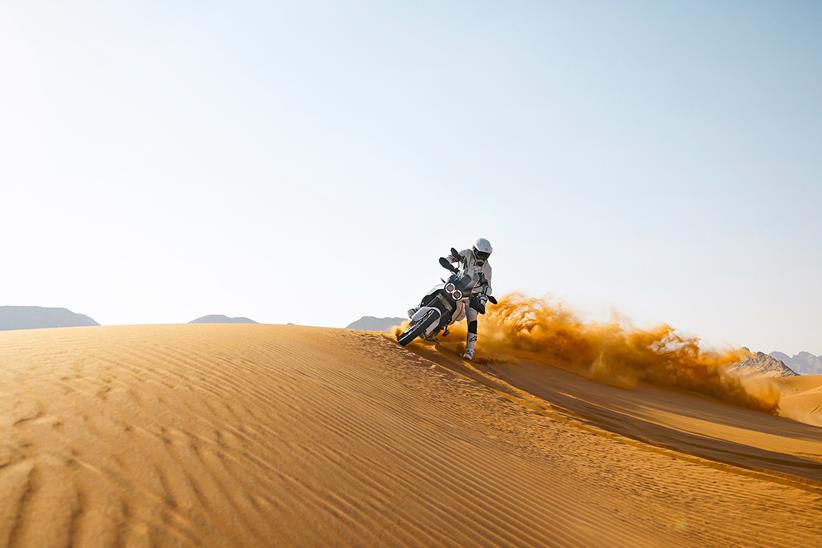 2022 Ducati DesertX carving a sand dune