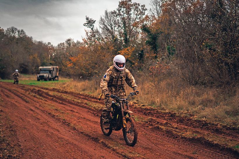 A soldier rides the Surron off-road in France