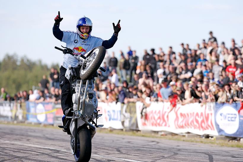 Chris Pfeiffer in action wowing crowds with a no-handed wheelie